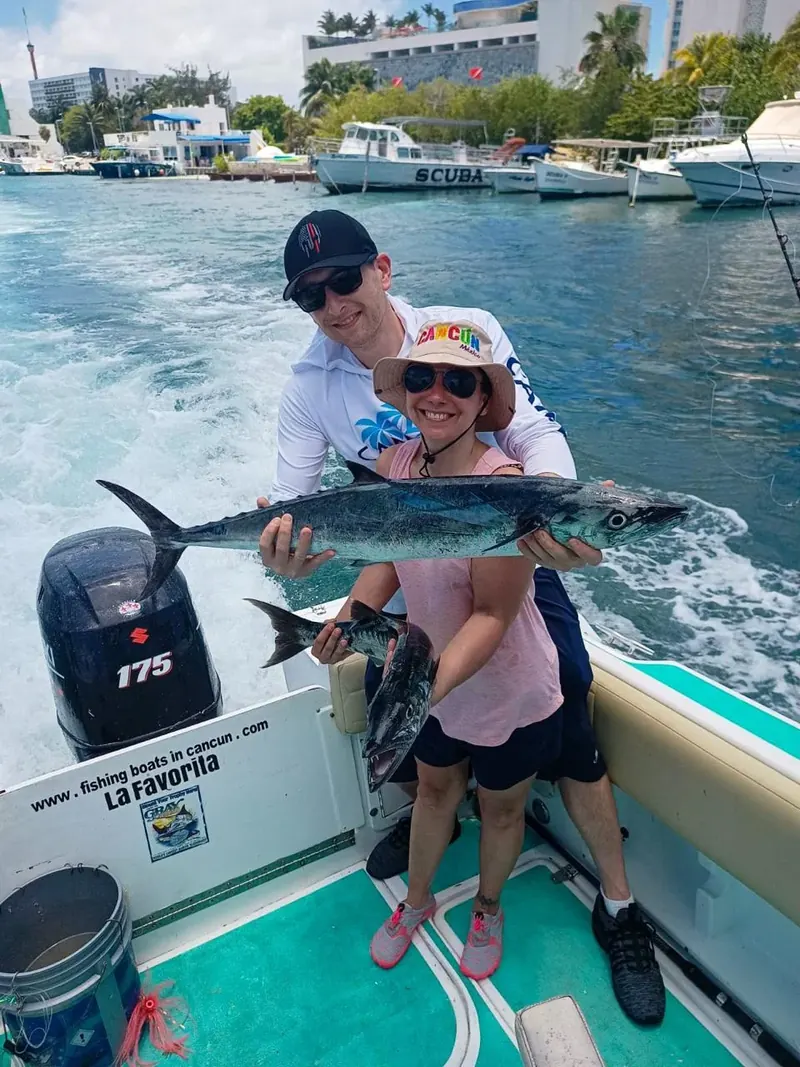 Anglers showing their catch after a fishing trip